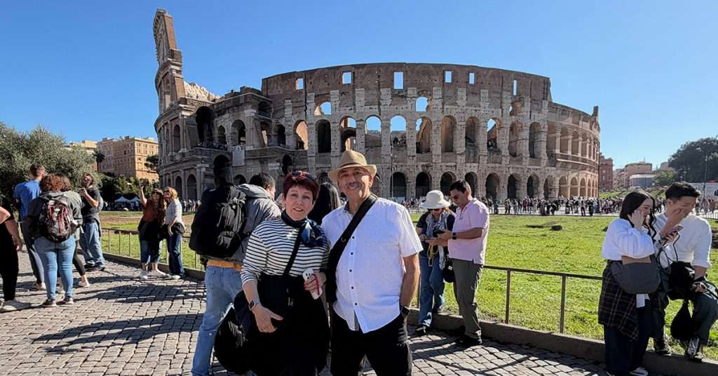 Using AI for travel journal Mike and Jacquie in front of the Colosseum